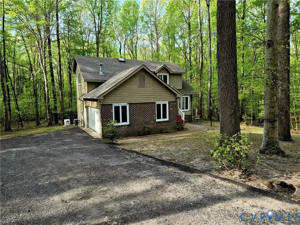 a house with trees in the background