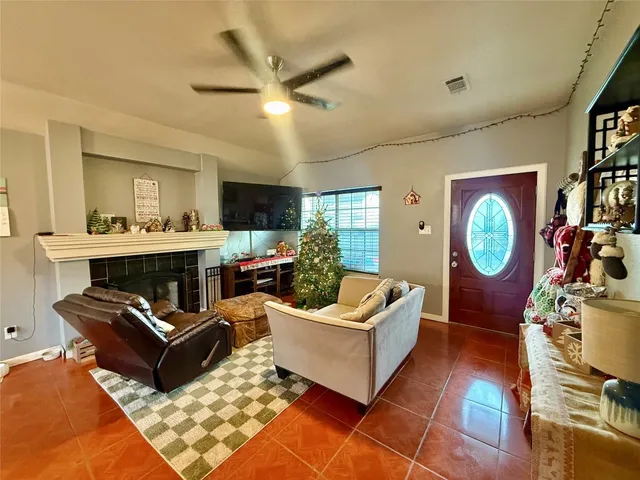 a living room with furniture a rug and a chandelier