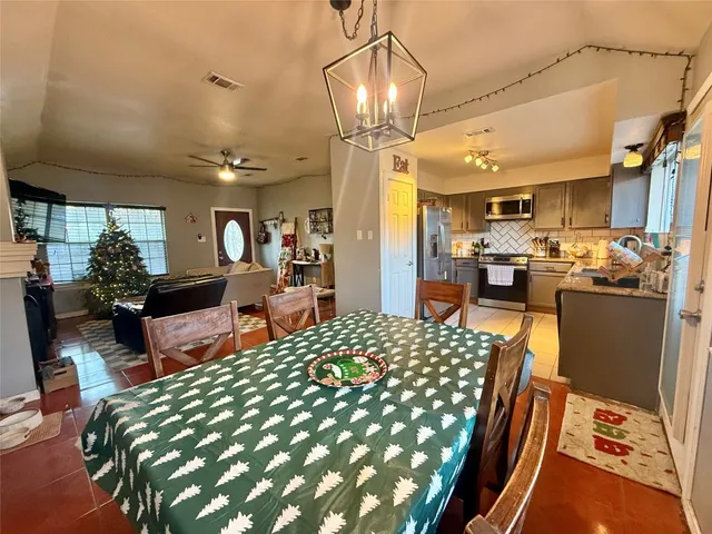 a large bedroom with a bed and glass table