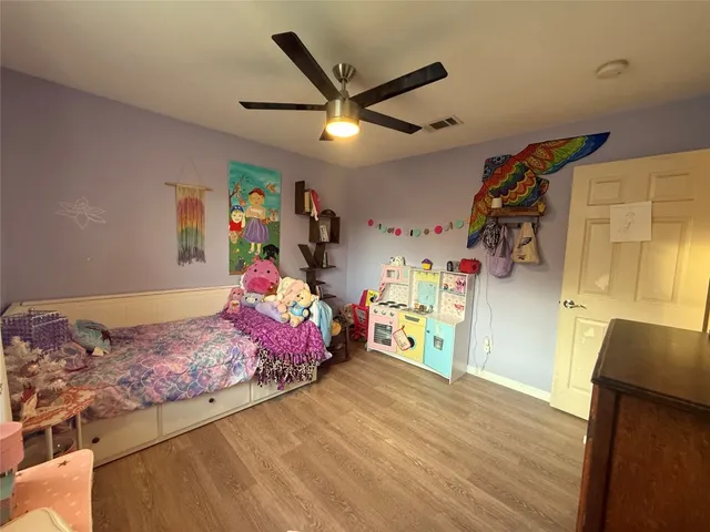 a bedroom with a bed and a walk in closet