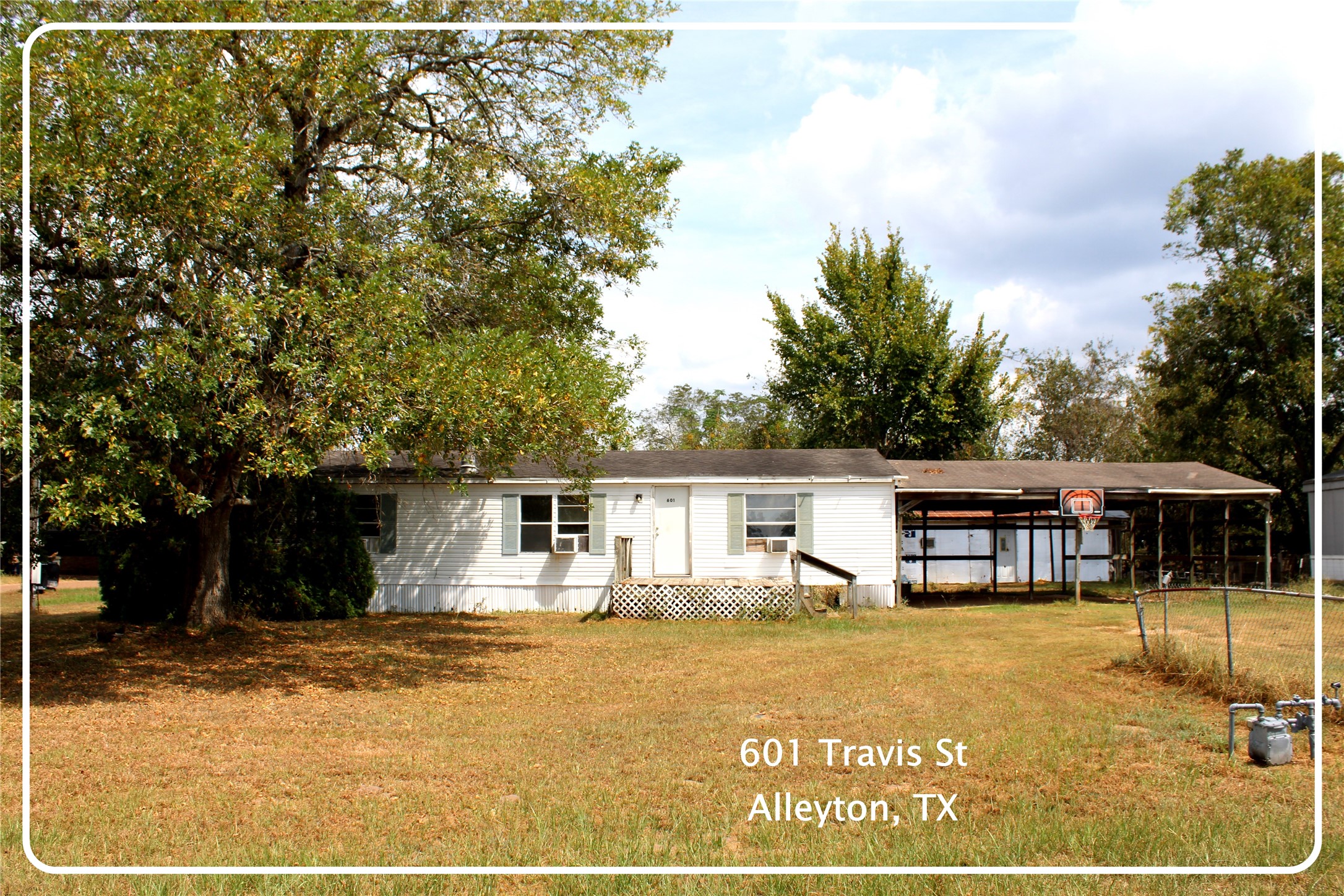601 Travis Street Alleyton, TX 78935 - Photo 1 of 17 a view of a house with swimming pool