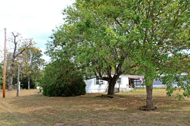 a view of a house with outdoor space and sitting area