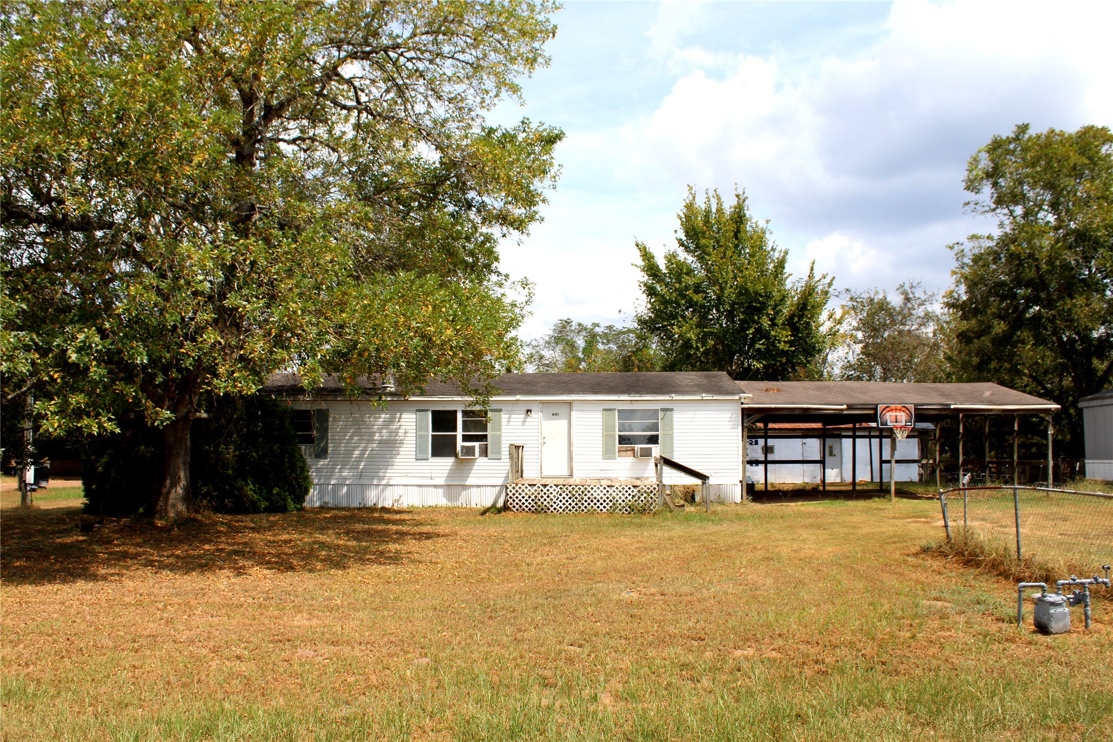 601 Travis Street Alleyton, TX 78935 - Photo 15 of 17 a view of a house with swimming pool