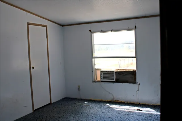 a bathroom with a shower and a sink