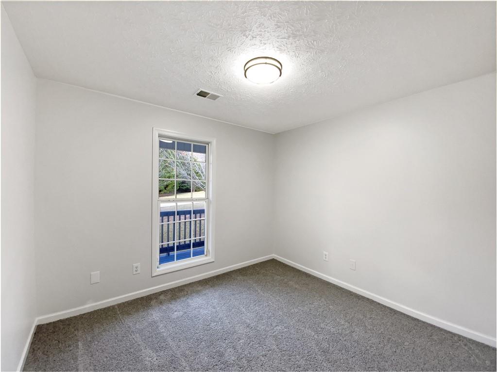 107 Jasons Ridge Griffin, GA 30223 - Photo 13 of 24 an empty room with windows