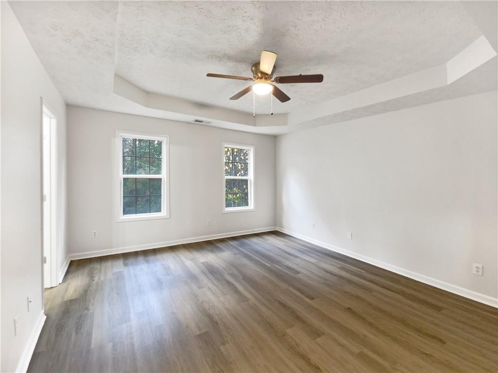 107 Jasons Ridge Griffin, GA 30223 - Photo 16 of 24 a view of empty room with wooden floor and fan