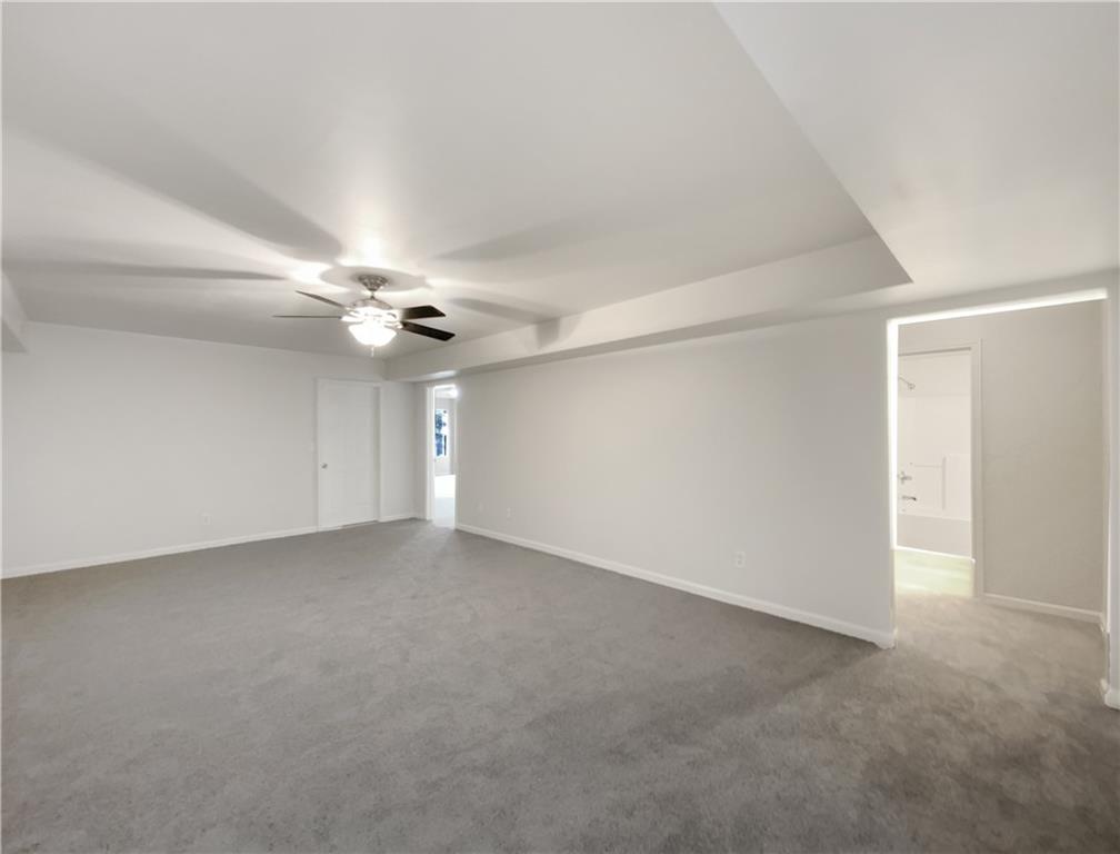 107 Jasons Ridge Griffin, GA 30223 - Photo 19 of 24 a view of an empty room with a ceiling fan