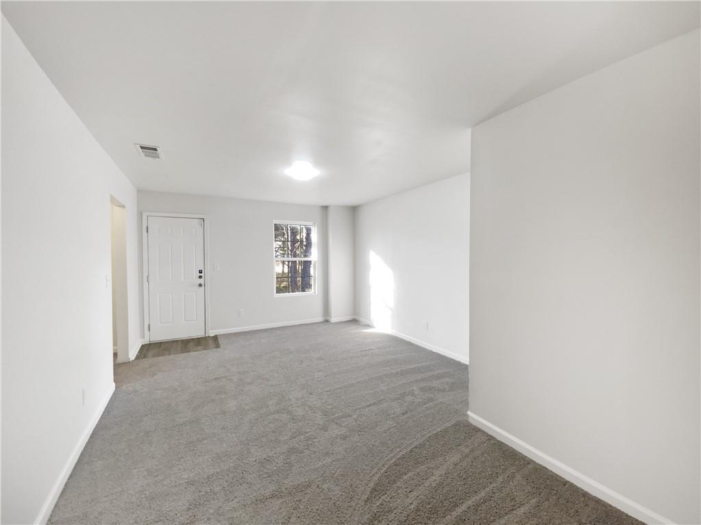 107 Jasons Ridge Griffin, GA 30223 - Photo 20 of 24 a view of an empty room with a window