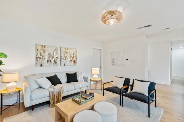 a view of a hallway with windows and closet