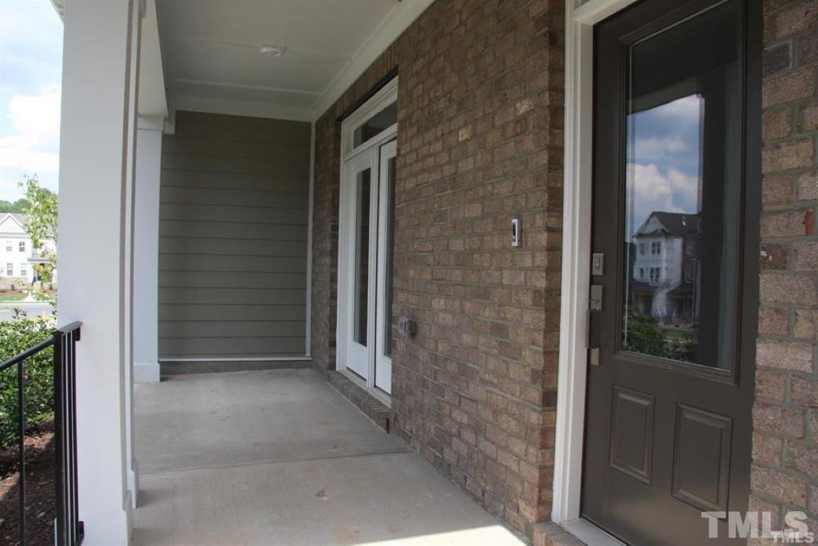 2919 Sunflower Road Apex, NC 27502 - Photo 3 of 34 a view of a glass door and a window