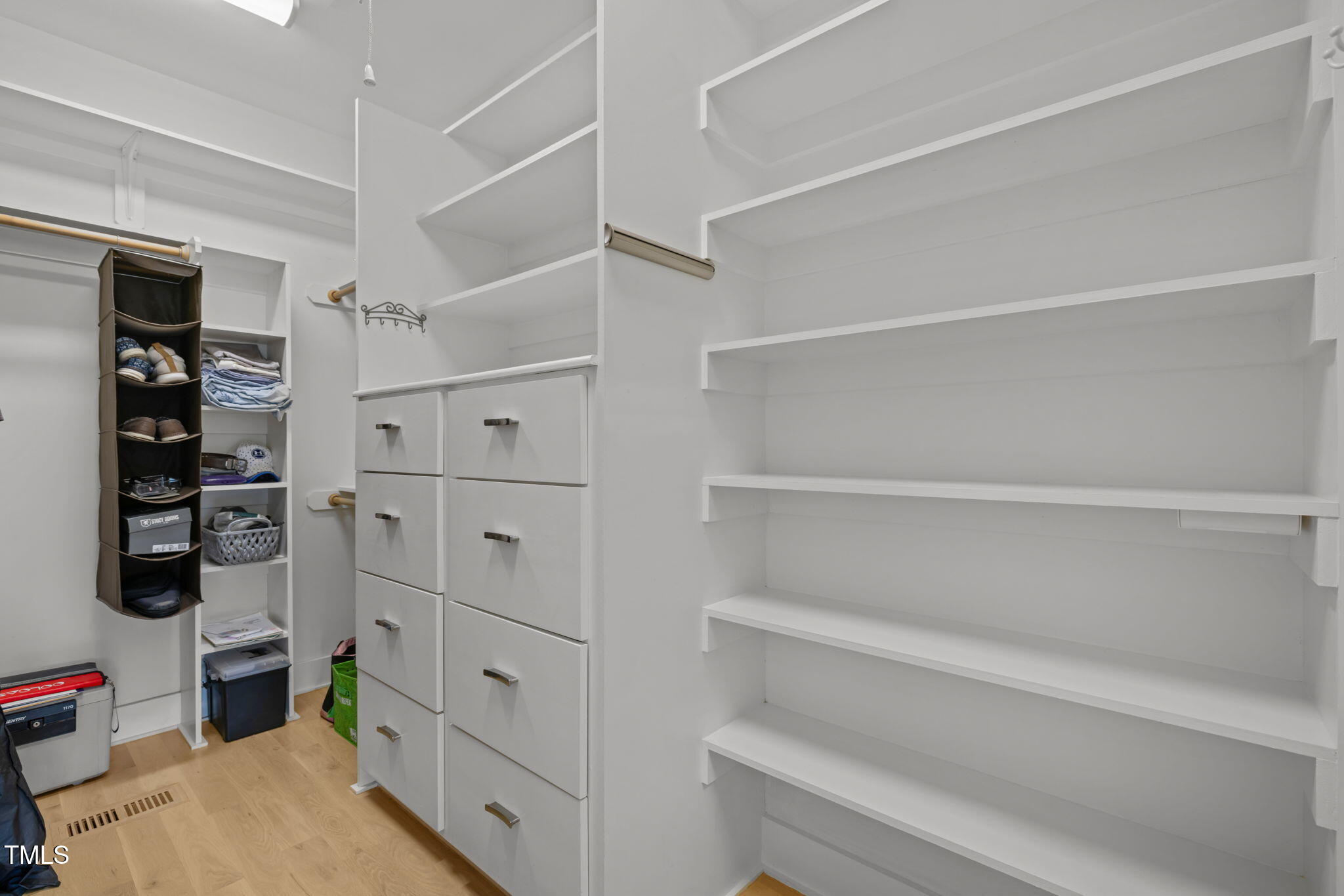 4715 Uzzle Road Rougemont, NC 27572 - Photo 25 of 68 a view of walk in closet with clothes and shoes