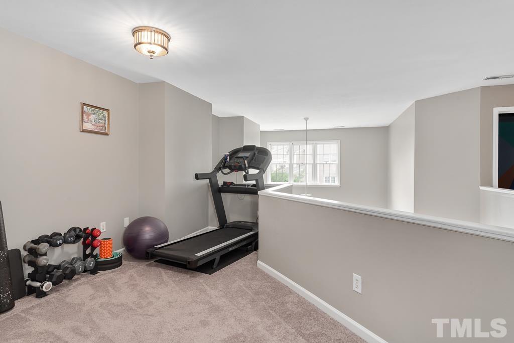7030 Sandy Forks Road, Unit 103 Raleigh, NC 27615 - Photo 18 of 36 a room with gym equipment