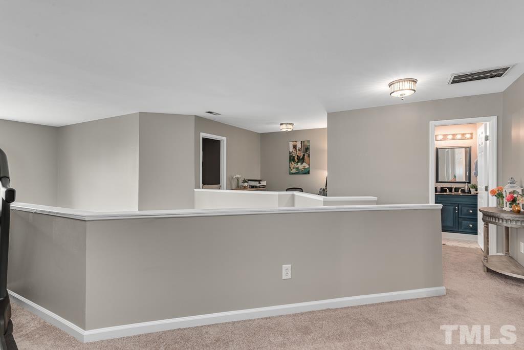 7030 Sandy Forks Road, Unit 103 Raleigh, NC 27615 - Photo 19 of 36 a living room with stainless steel appliances kitchen island a large window in it