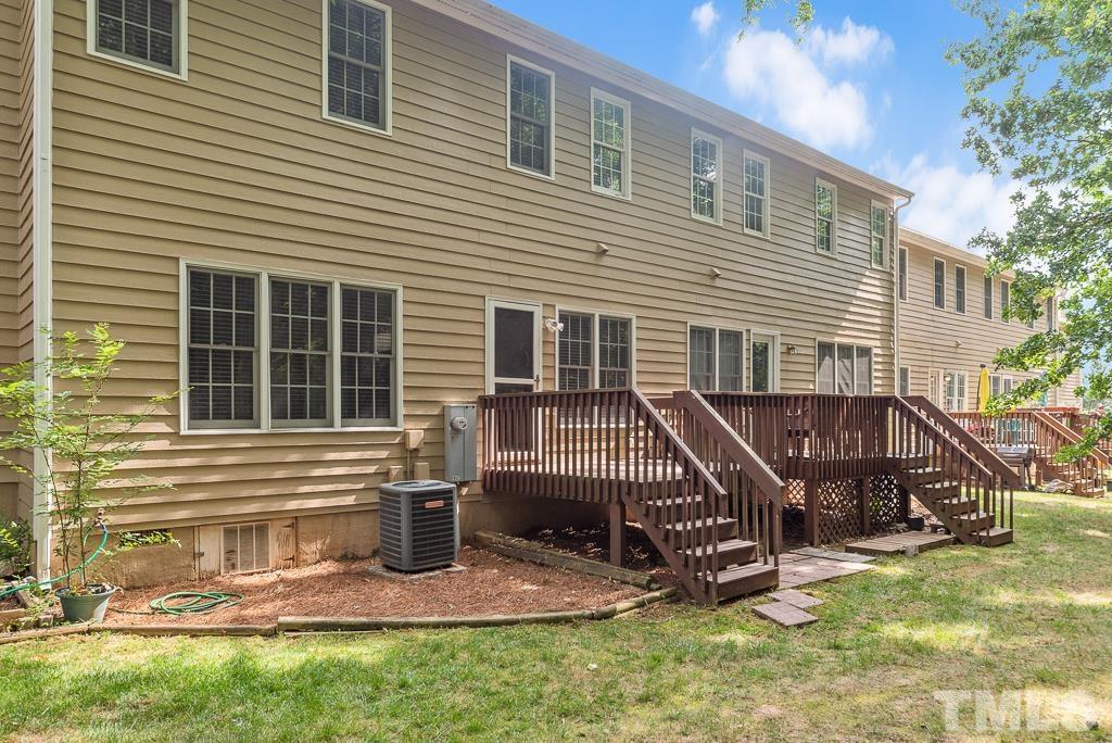 7030 Sandy Forks Road, Unit 103 Raleigh, NC 27615 - Photo 29 of 36 a view of house with a yard