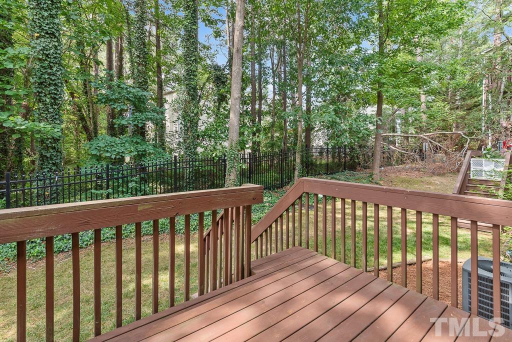 7030 Sandy Forks Road, Unit 103 Raleigh, NC 27615 - Photo 31 of 36 a view of a wooden roof deck