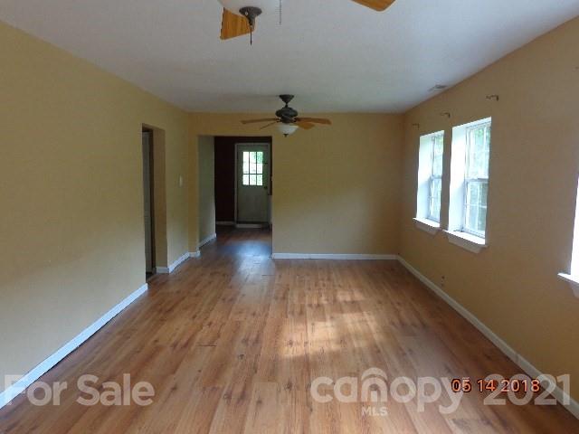 40 Royal Fern Road Sylva, NC 28779 - Photo 5 of 9 wooden floor in an empty room with a window