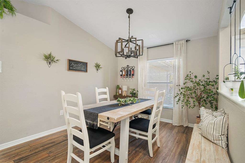 10464 Henderson Street Spring Hill, FL 34608 - Photo 11 of 62 a view of a dining room with furniture window and wooden floor