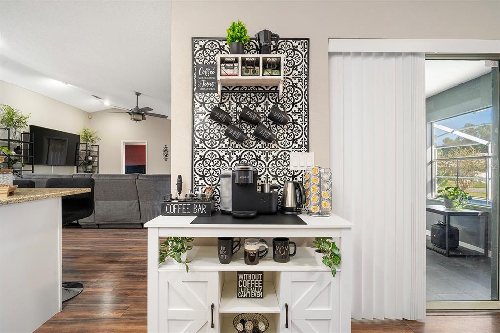 10464 Henderson Street Spring Hill, FL 34608 - Photo 18 of 62 a view of living room with furniture and flat screen tv