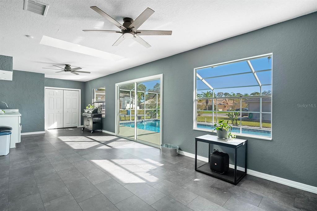10464 Henderson Street Spring Hill, FL 34608 - Photo 20 of 62 a view of a livingroom with workspace and a window