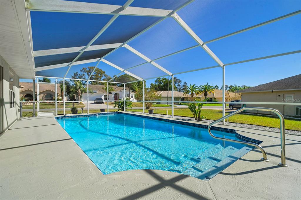 10464 Henderson Street Spring Hill, FL 34608 - Photo 25 of 62 a view of a backyard with swimming pool