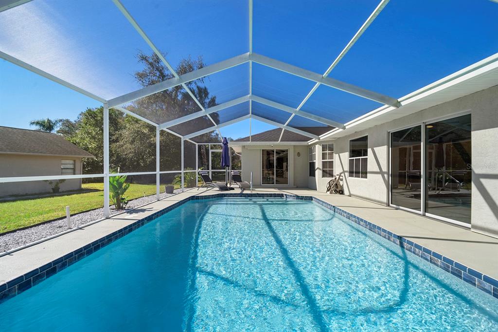 10464 Henderson Street Spring Hill, FL 34608 - Photo 26 of 62 a view of a backyard with swimming pool