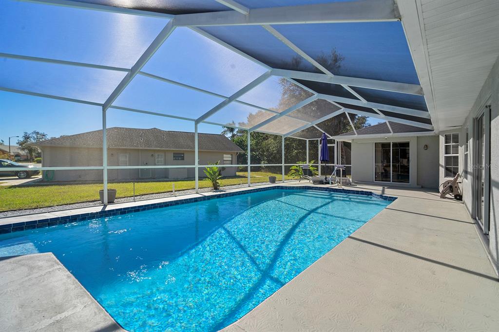 10464 Henderson Street Spring Hill, FL 34608 - Photo 27 of 62 a view of a backyard with a swimming pool