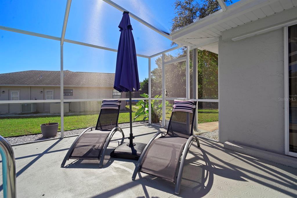 10464 Henderson Street Spring Hill, FL 34608 - Photo 29 of 62 a view of a chairs and table in the patio