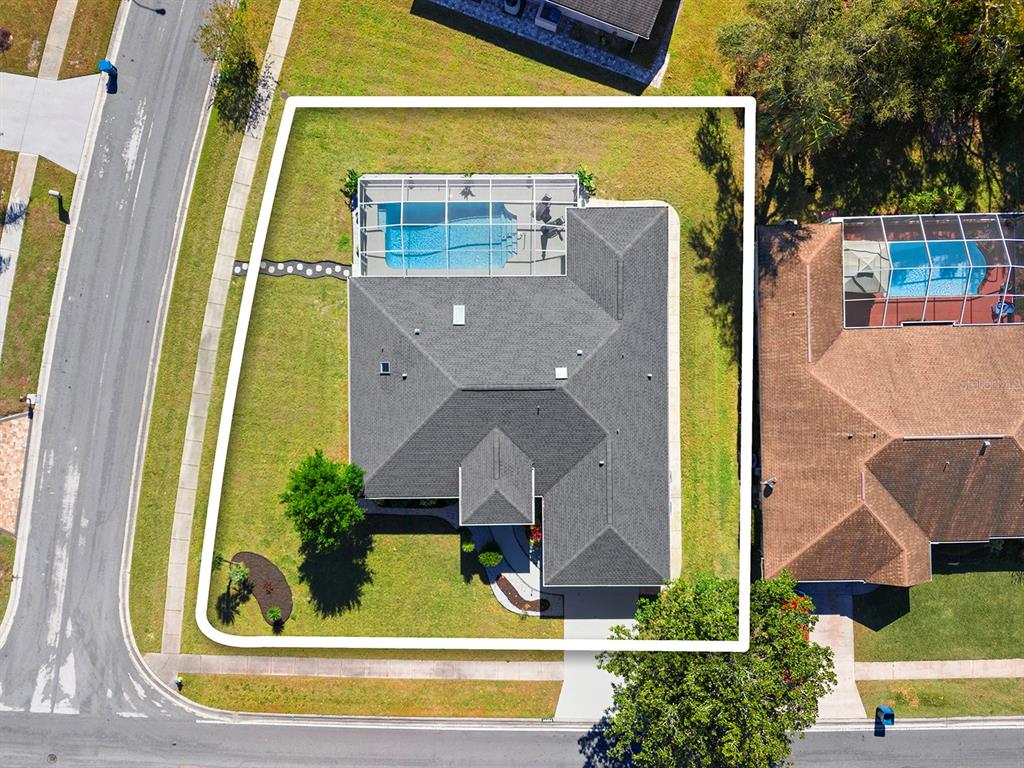 10464 Henderson Street Spring Hill, FL 34608 - Photo 49 of 62 an aerial view of a house with a swimming pool
