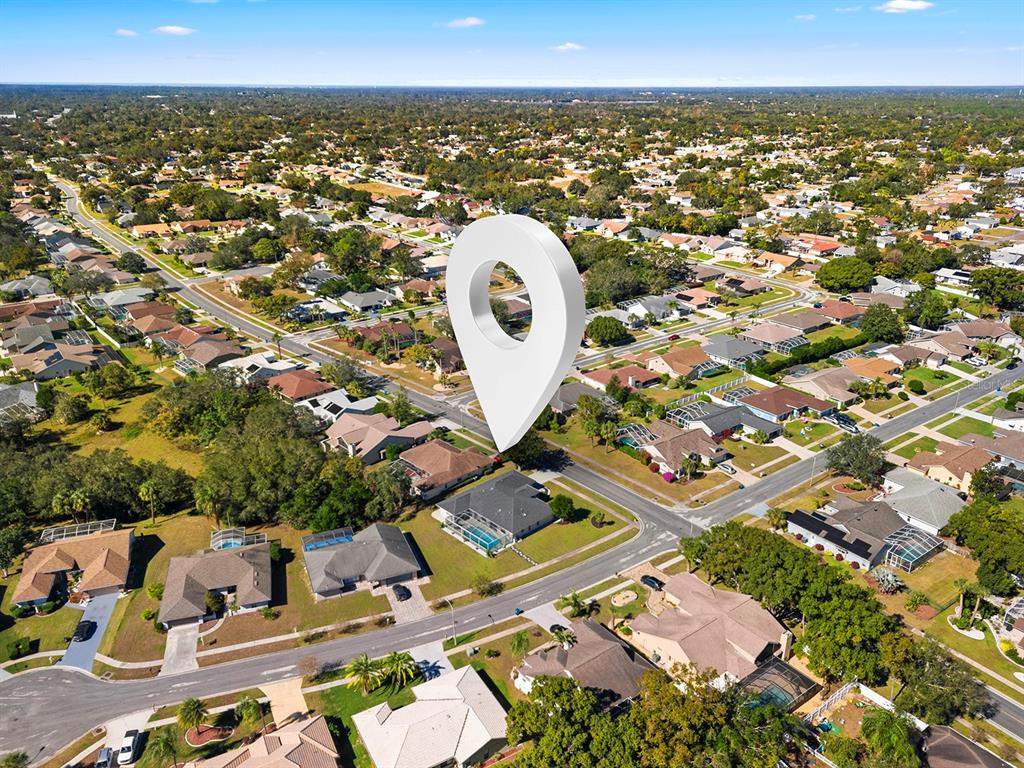 10464 Henderson Street Spring Hill, FL 34608 - Photo 61 of 62 an aerial view of a house with a garden