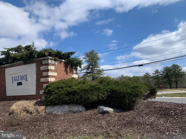 a view of a street with a building in the background