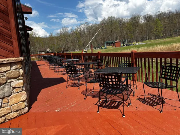 a view of a chairs and table in the terrace