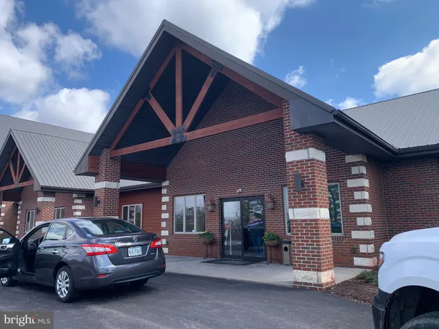 a view of cars parked in front of a building