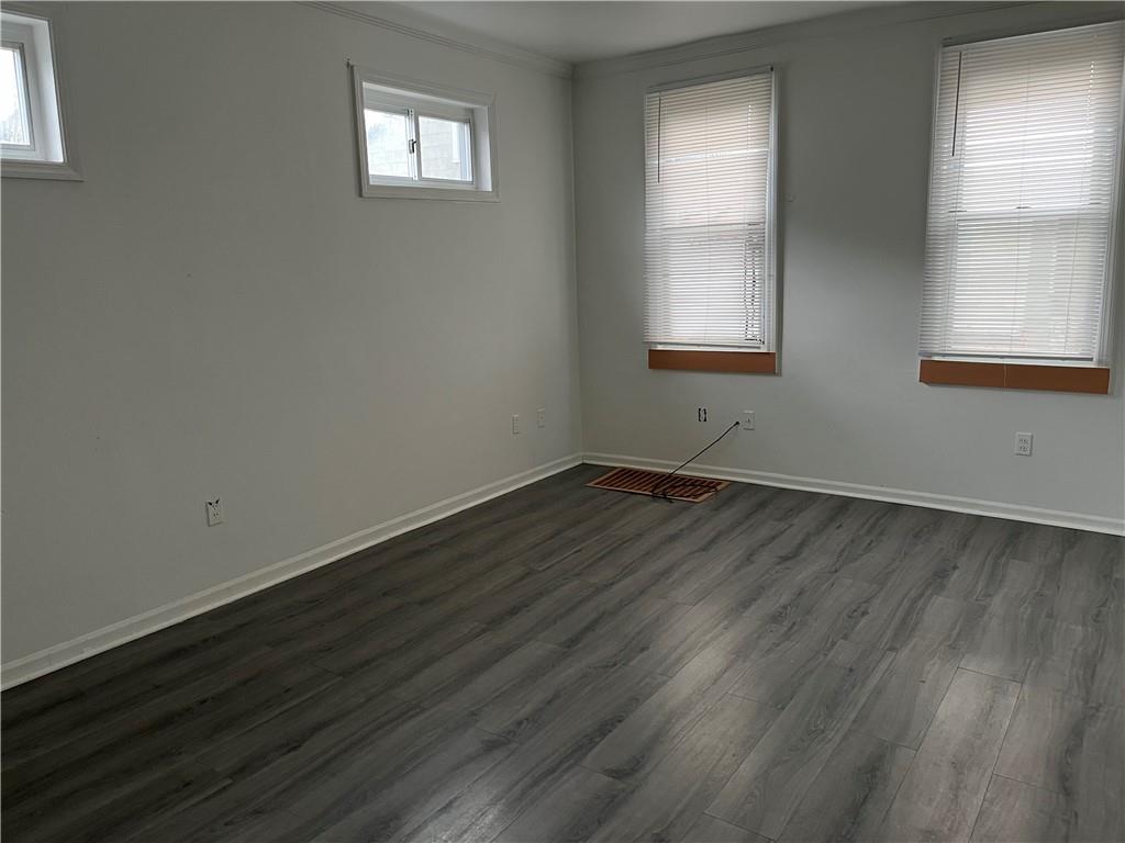 1700 Haug Street Pittsburgh, PA 15212 - Photo 12 of 32 an empty room with wooden floor and windows
