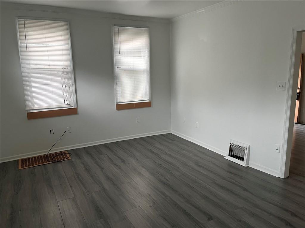 1700 Haug Street Pittsburgh, PA 15212 - Photo 13 of 32 an empty room with wooden floor and windows