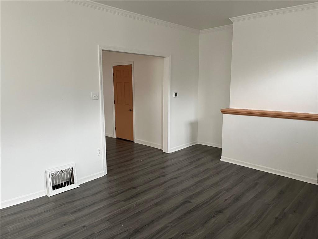 1700 Haug Street Pittsburgh, PA 15212 - Photo 14 of 32 an empty room with wooden floor and closet