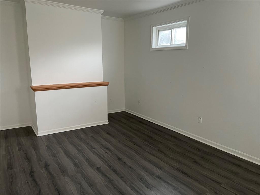 1700 Haug Street Pittsburgh, PA 15212 - Photo 15 of 32 a view of an empty room with wooden floor and a window