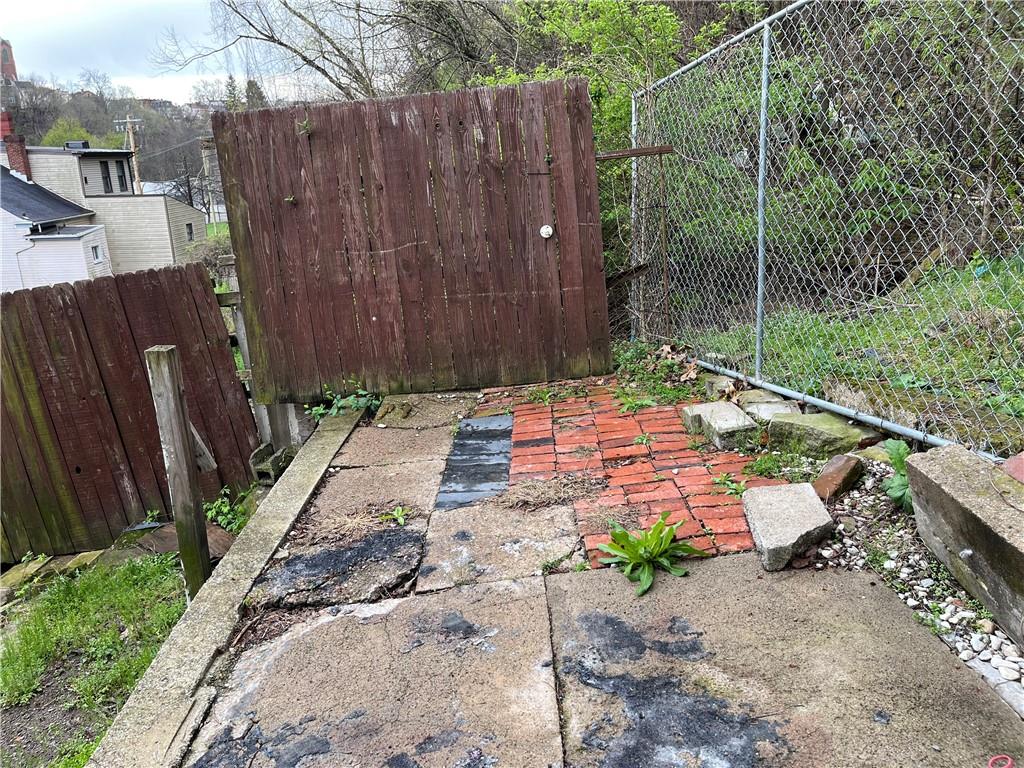 1700 Haug Street Pittsburgh, PA 15212 - Photo 31 of 32 a wooden bench sitting in front of a wooden fence