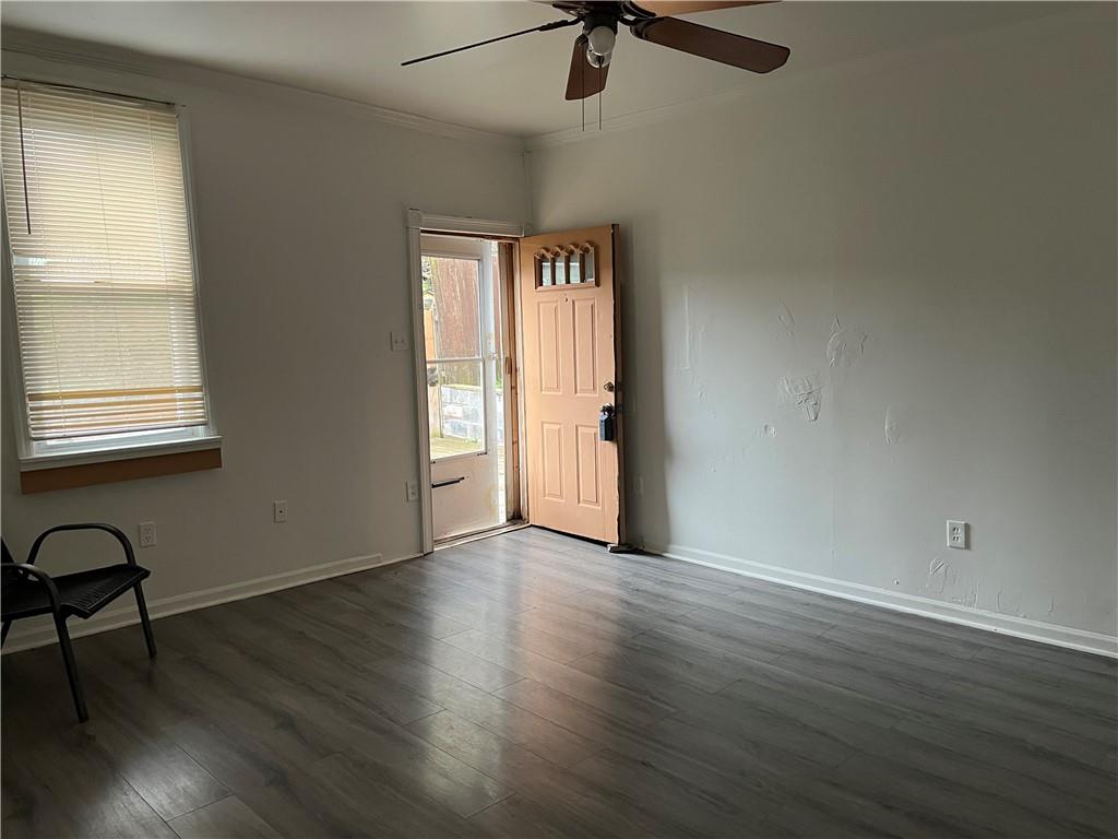 1700 Haug Street Pittsburgh, PA 15212 - Photo 5 of 32 an empty room with wooden floor and windows