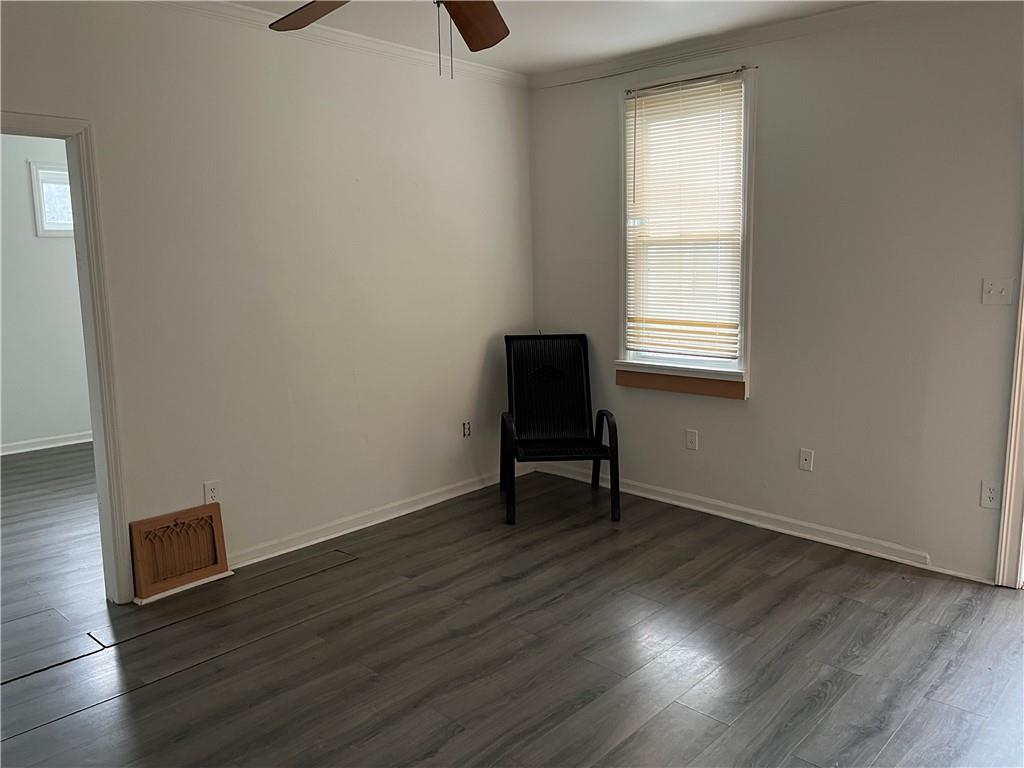 1700 Haug Street Pittsburgh, PA 15212 - Photo 7 of 32 a view of an empty room with wooden floor and a window