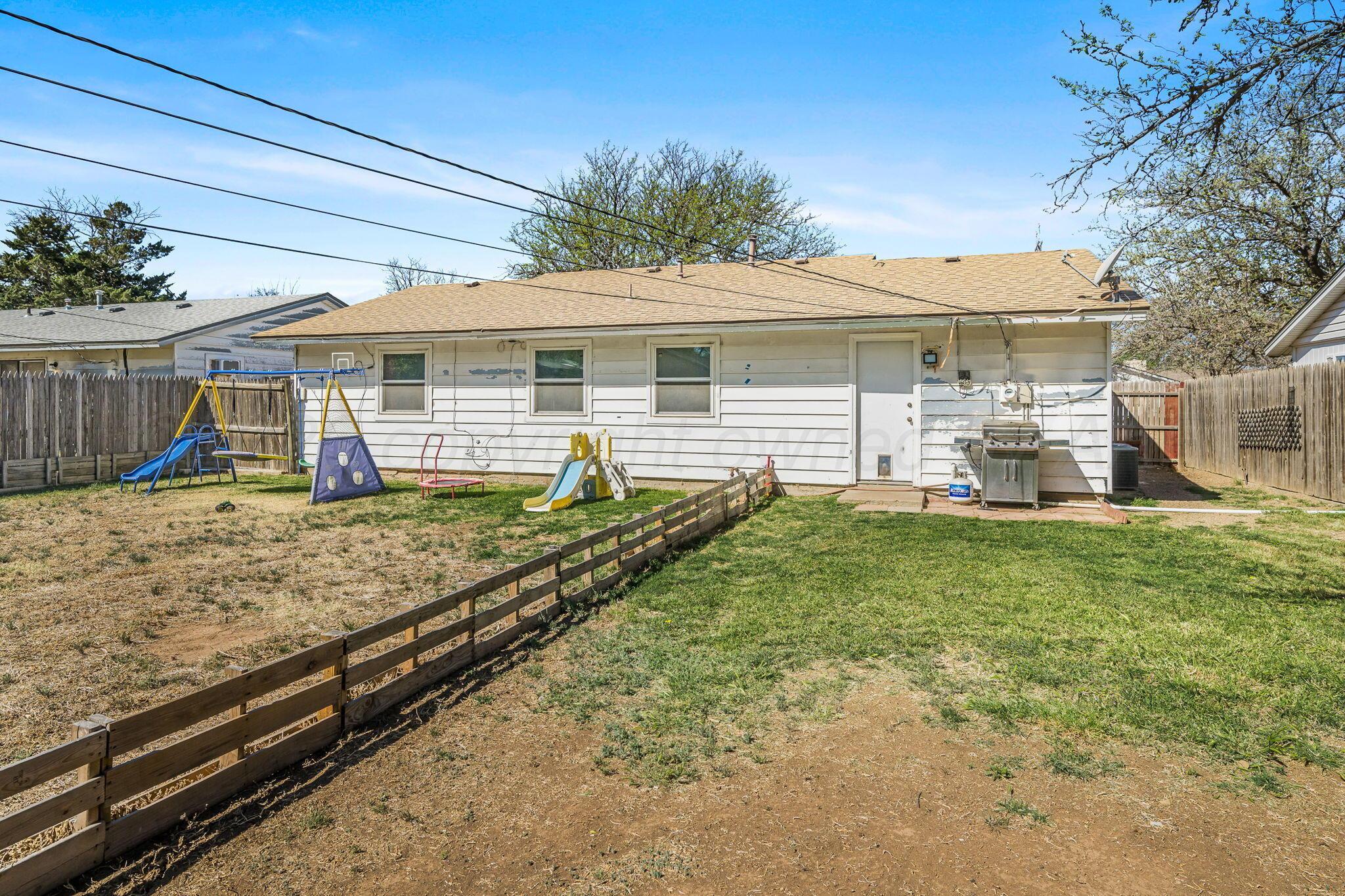 2907 South Manhattan Street Amarillo, TX 79103 - Photo 14 of 16 a front view of a house with garden