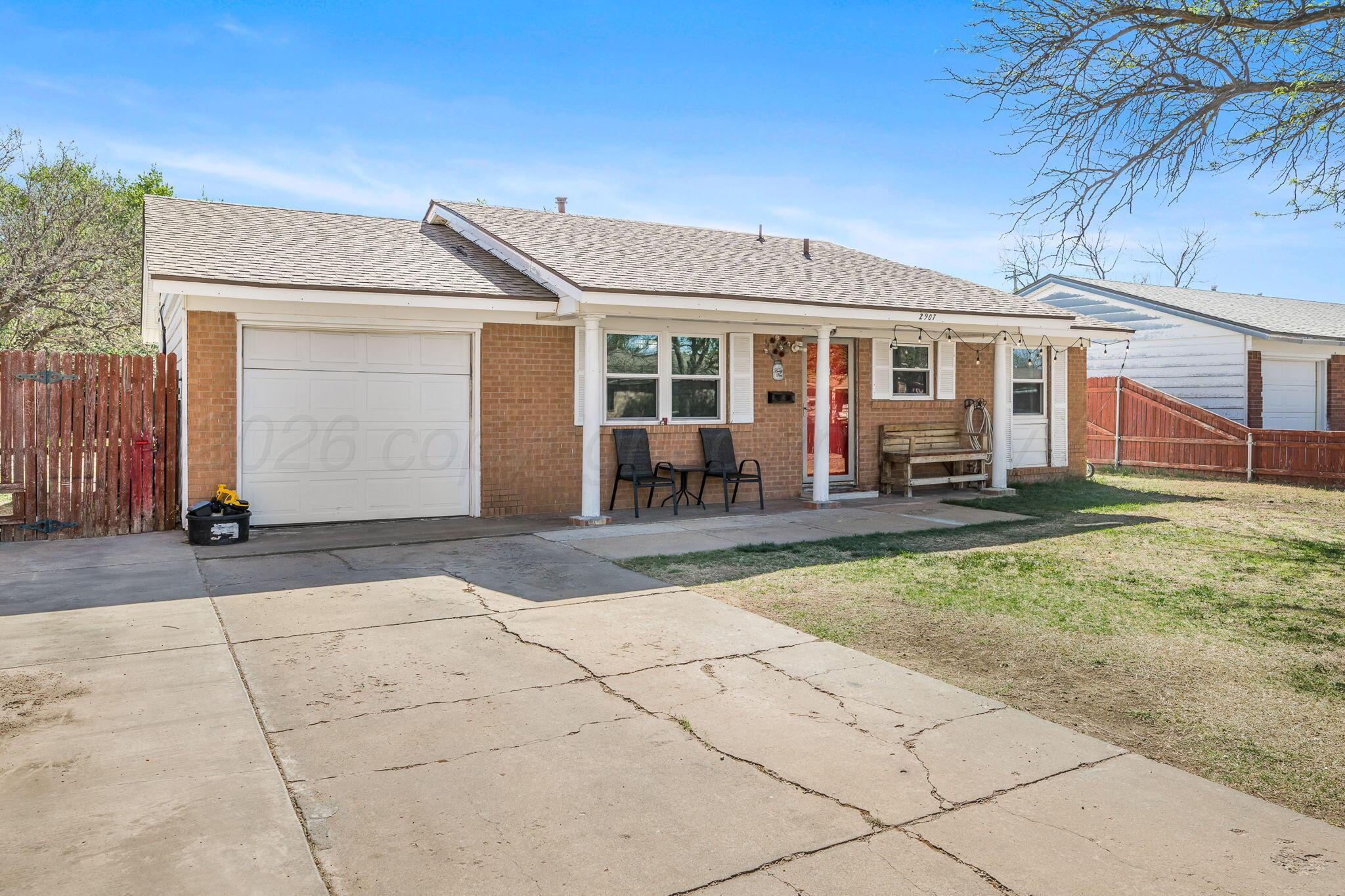 2907 South Manhattan Street Amarillo, TX 79103 - Photo 2 of 16 front view of a house with a patio