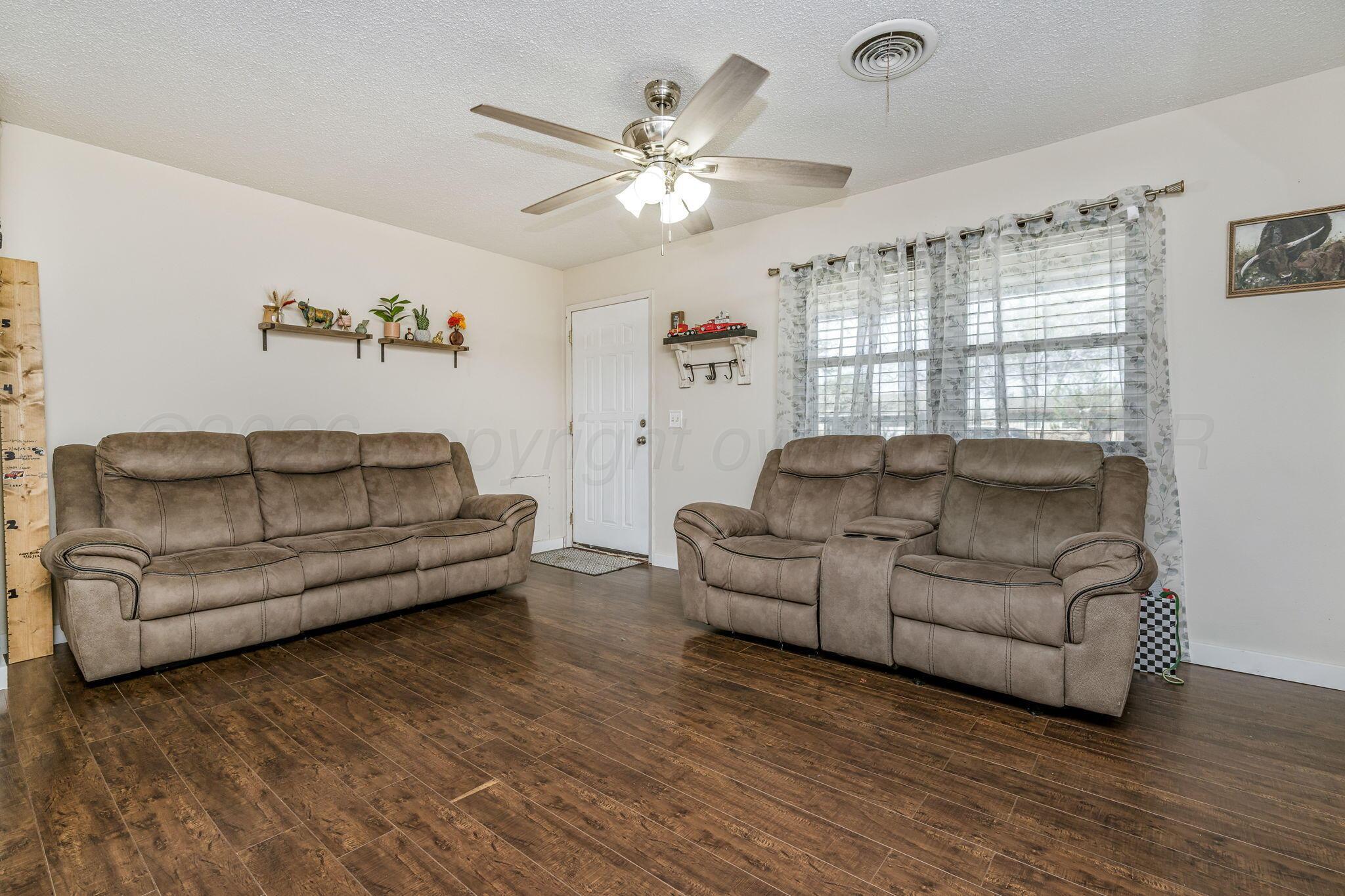 2907 South Manhattan Street Amarillo, TX 79103 - Photo 4 of 16 a living room with furniture and a large window