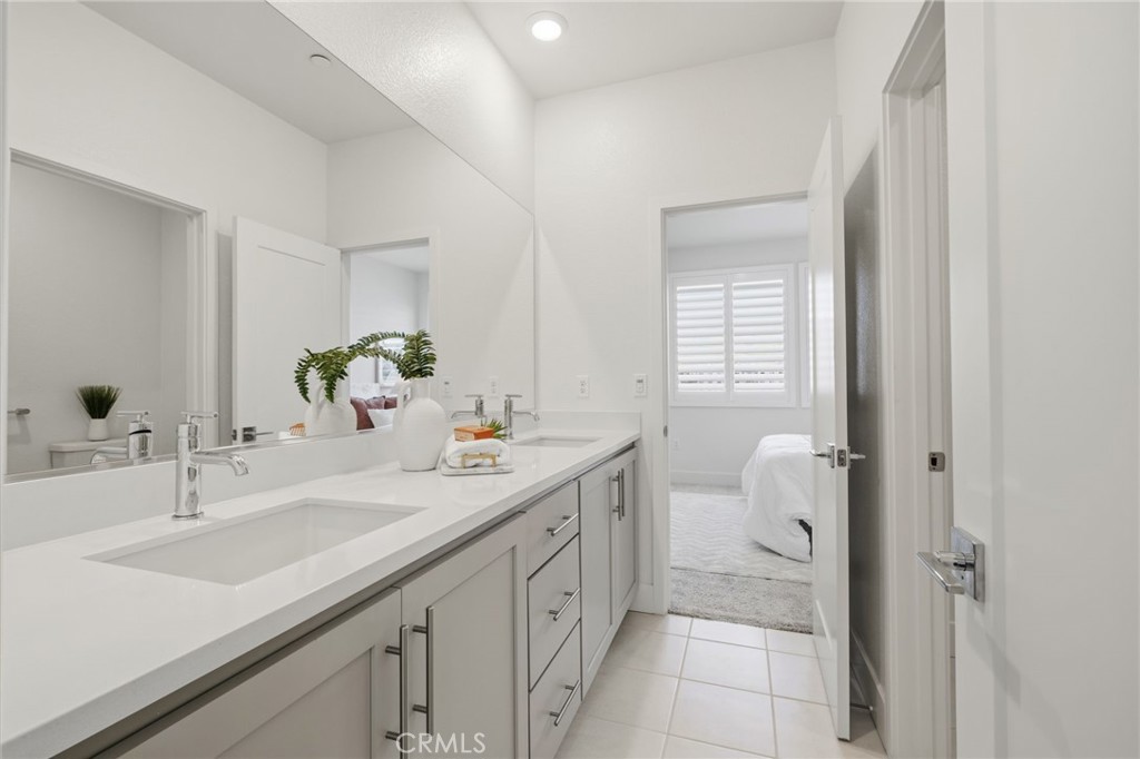 45235 Wisdom Road, Unit 1003 Fremont, CA 94538 - Photo 16 of 32 a bathroom with a sink and a mirror