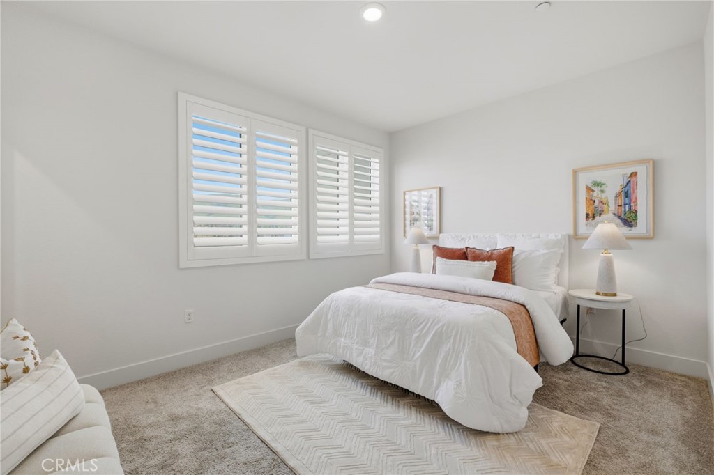 45235 Wisdom Road, Unit 1003 Fremont, CA 94538 - Photo 17 of 32 a bedroom with a bed and a window