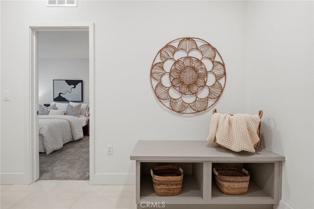 45235 Wisdom Road, Unit 1003 Fremont, CA 94538 - Photo 20 of 32 a bedroom with a bed and a lamp on dresser