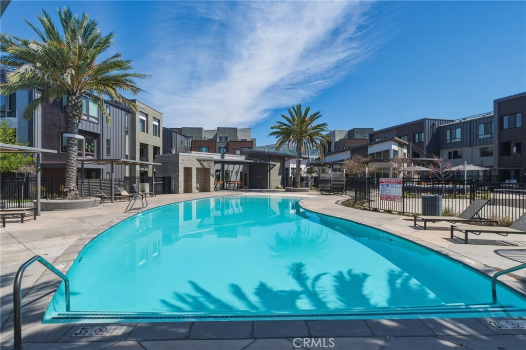 45235 Wisdom Road, Unit 1003 Fremont, CA 94538 - Photo 24 of 32 a swimming pool with outdoor seating and yard