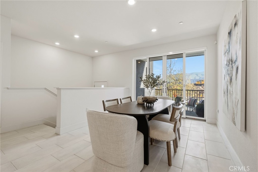 45235 Wisdom Road, Unit 1003 Fremont, CA 94538 - Photo 5 of 32 a dining room with furniture and a large window