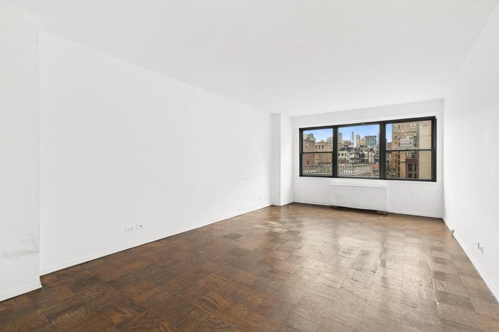 10 West 15th Street, Unit 1623 Manhattan, NY 10011 - Photo 4 of 7 an empty room with windows