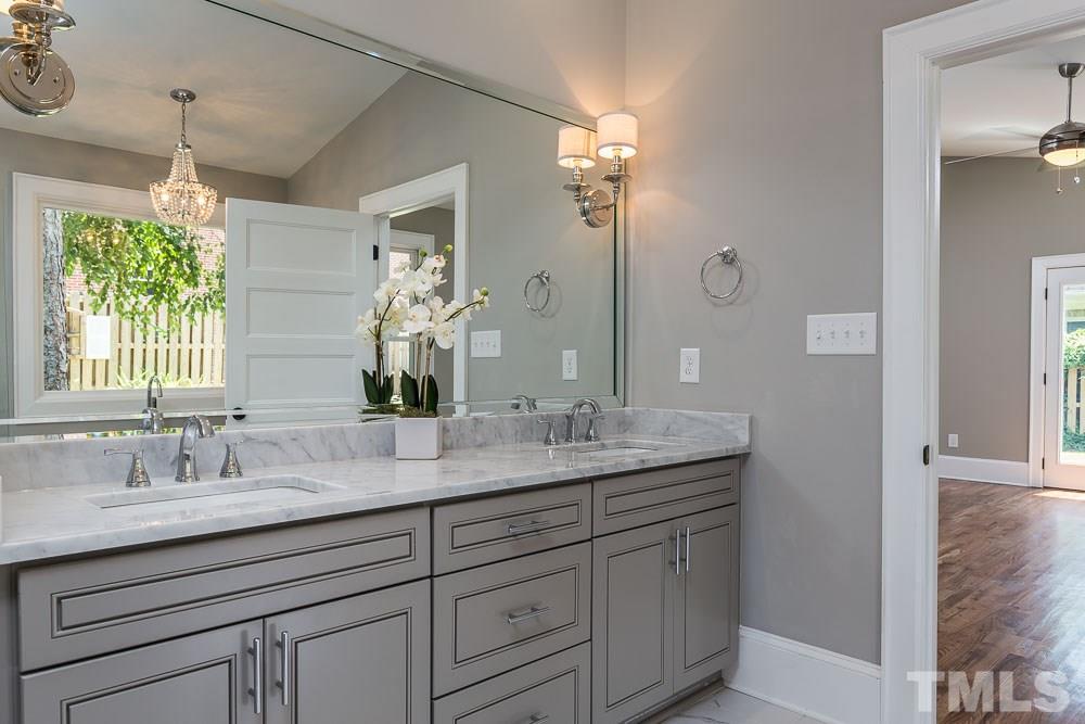 2417 Fairview Road Raleigh, NC 27608 - Photo 14 of 25 a bathroom with double sink and a mirror