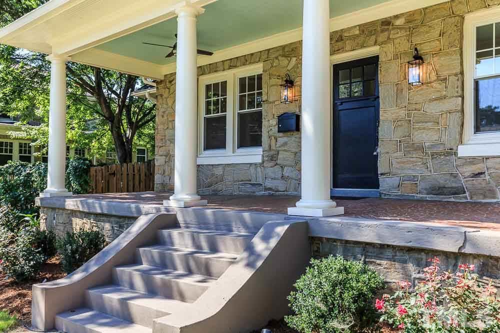 2417 Fairview Road Raleigh, NC 27608 - Photo 3 of 25 front view of a house with a large window and potted plants